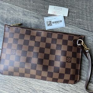 Authentic Louis Vuitton wristlet. From GM Never full.